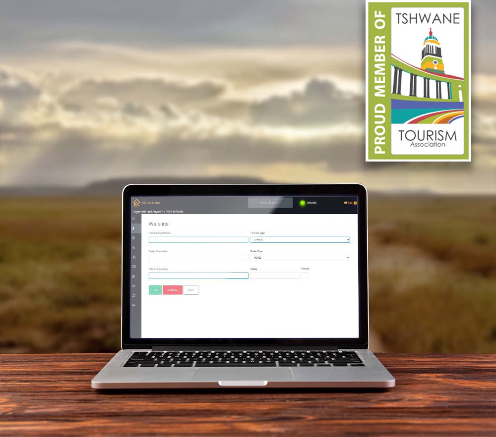 Laptop on a desk and with RoomSeeker platform and Tshwane Tourism membership badge on screen